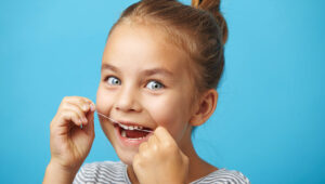 Home 12 child flossing